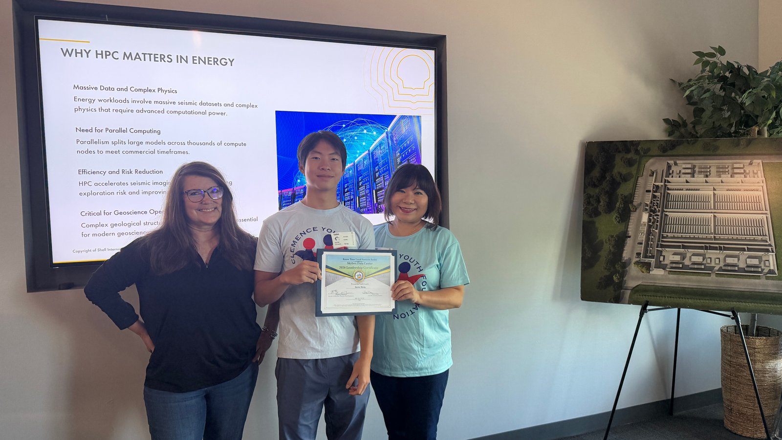 Xavier holding his 2026 Leadership Certificate at SkyBox Data Center
